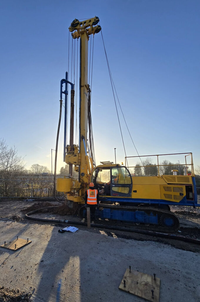 Dawson FE piling rig with operators at dusk