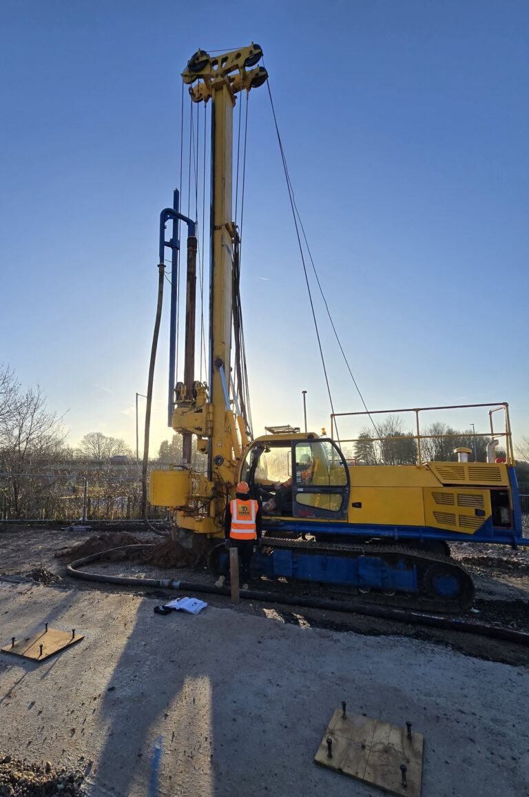 Dawson FE piling rig with operators at dusk